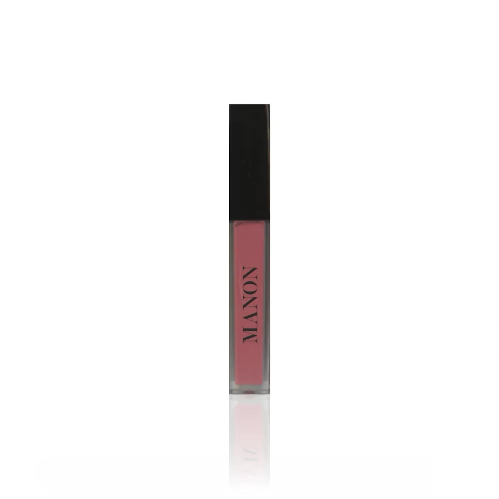 A Manon liquid lip product in a clear container filled with dusty rose colored liquid, featuring a black cap, displayed on a reflective white surface.